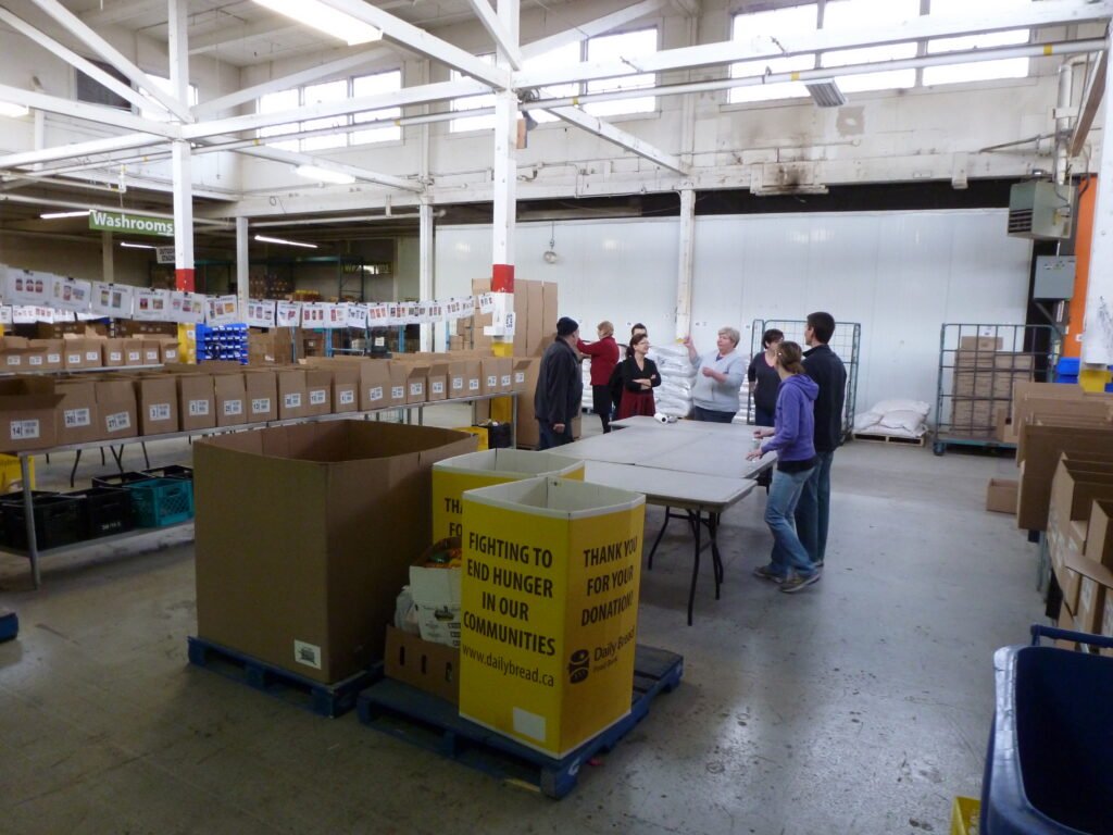 Volunteers working together at a food bank